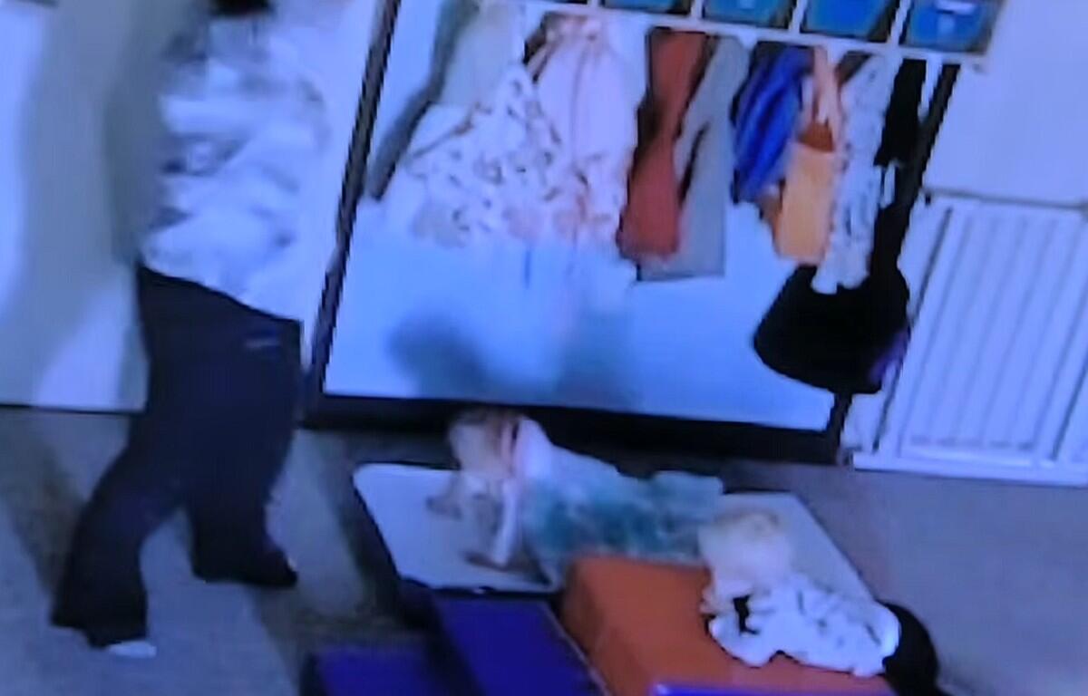 Surveillance video from the daycare showing Sarah Fuson, left, and the victim on the sleeping cot. (Court video, contributed)
