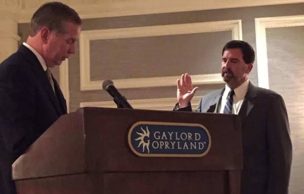 Jeff Burkhart is sworn in as president of the Tennessee Home Builders Association in 2015, by then-67th District State Rep. Joe Pitts. (Contributed)