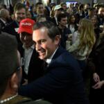 Republican candidate Matt Van Epps interacts with supporters at a watch party after announcing victory in a special election for the U.S. seventh congressional district, Tuesday, Dec. 2, 2025, in Nashville, Tenn. (AP Photo/John Amis)