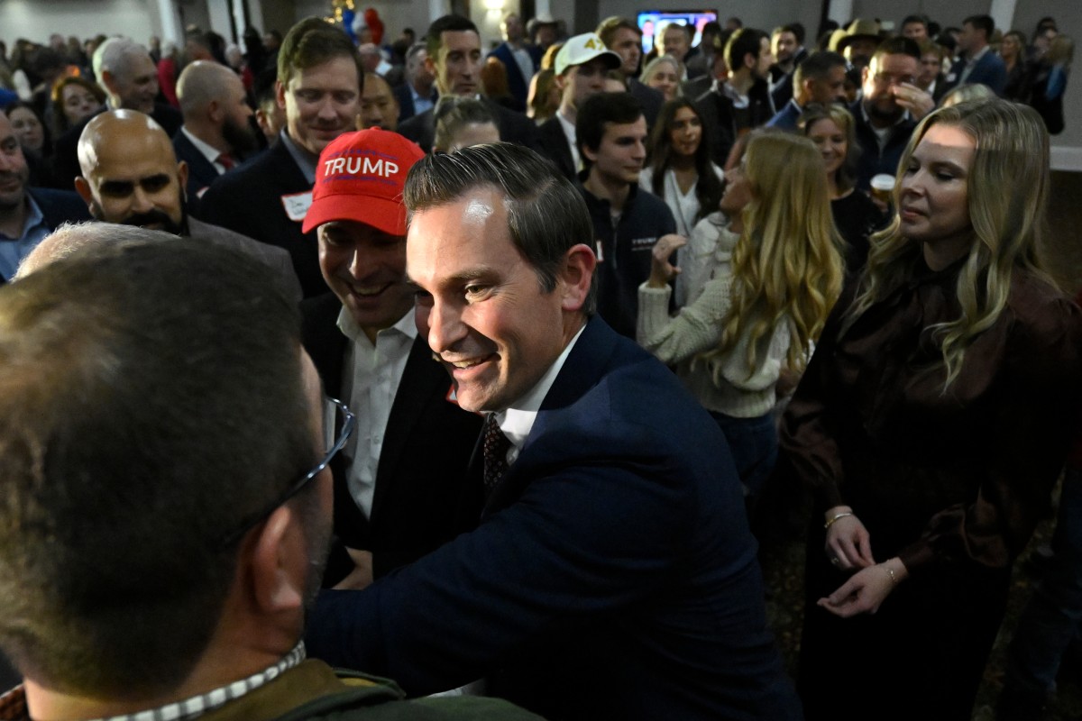 Republican candidate Matt Van Epps interacts with supporters at a watch party after announcing victory in a special election for the U.S. seventh congressional district, Tuesday, Dec. 2, 2025, in Nashville, Tenn. (AP Photo/John Amis)