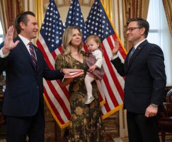 Rep. Matt Van Epps, R-Tenn, left, takes part in a ceremonial swearing-in with Speaker Mike Johnson, R-La., Thursday, Dec. 4, 2025, in Washington. Holding the Bible is Van Epps' wife, Meg Wrather, and their daughter, Amelia Van Epps. (AP Photo/Kevin Wolf)