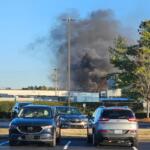 Smoke is seen in the distance where a trailer caught fire in the Trane parking lot on Dec. 29, 2025. (Contributed by Rhett Newton)