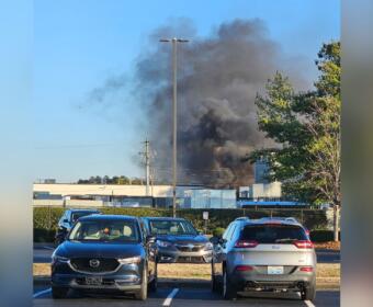 Smoke is seen in the distance where a trailer caught fire in the Trane parking lot on Dec. 29, 2025. (Contributed by Rhett Newton)