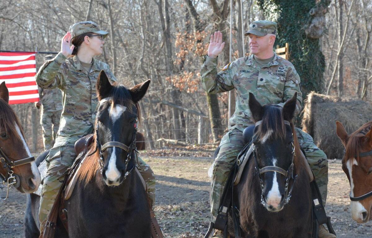 Cpl. Savannah Gibson-Sateen, left, and Lt. Col. Philip Bowling during the reenlistment ceremony at Veteran Equine Time on Dec. 17, 2025. (Lee Erwin)