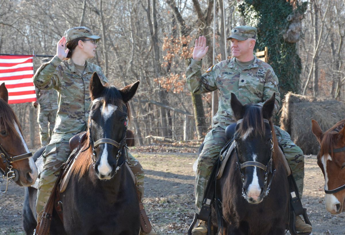 Cpl. Savannah Gibson-Sateen, left, and Lt. Col. Philip Bowling during the reenlistment ceremony at Veteran Equine Time on Dec. 17, 2025. (Lee Erwin)