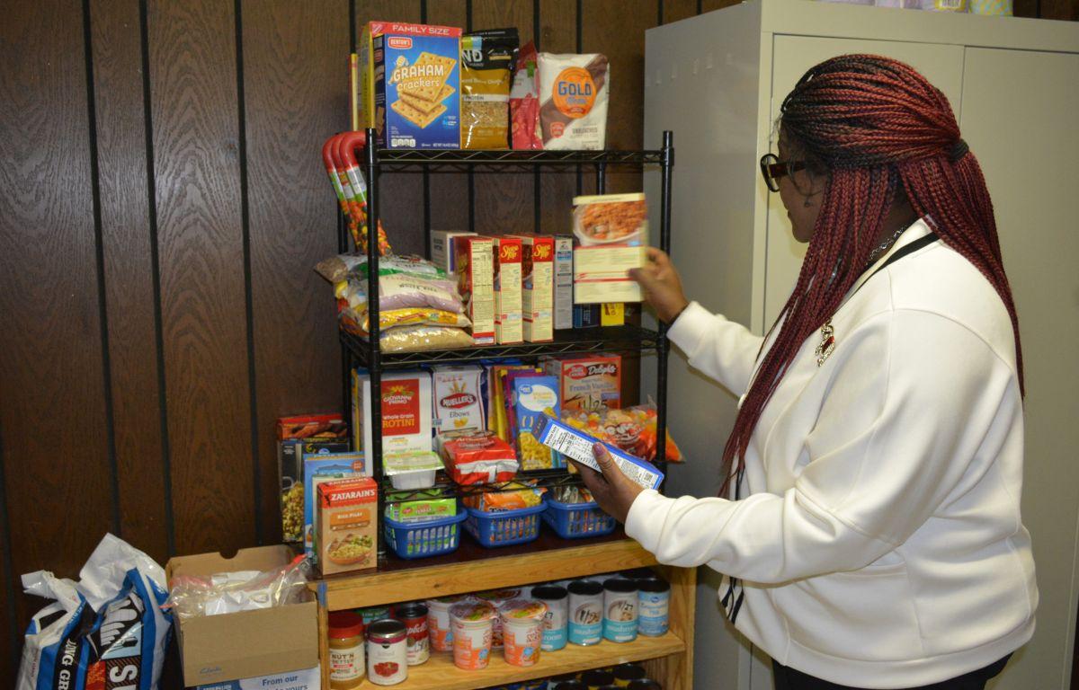 Dr. Johnnie Smith looks over items in the Grocery Grab Giveaway Community Food Pantry at St. Peter's AME Church on Jan. 18, 2026. (Lee Erwin)