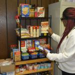 Dr. Johnnie Smith looks over items in the Grocery Grab Giveaway Community Food Pantry at St. Peter's AME Church on Jan. 18, 2026. (Lee Erwin)