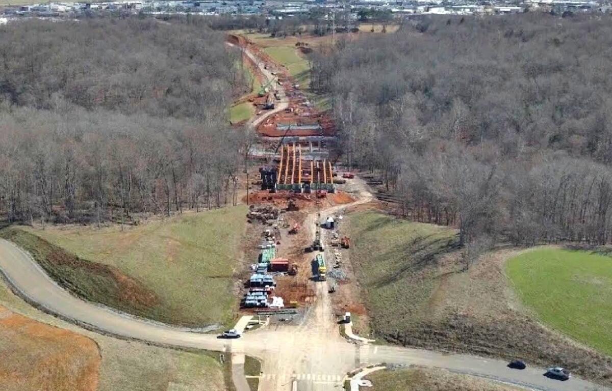 Aerial photo of progress on Spring Creek Parkway as of March 25, 2026. Shown is the bridge over Spring Creek, looking southeast toward Wilma Rudolph Boulevard, with Walmart at left and Kohls at right. (City of Clarksville, contributed)