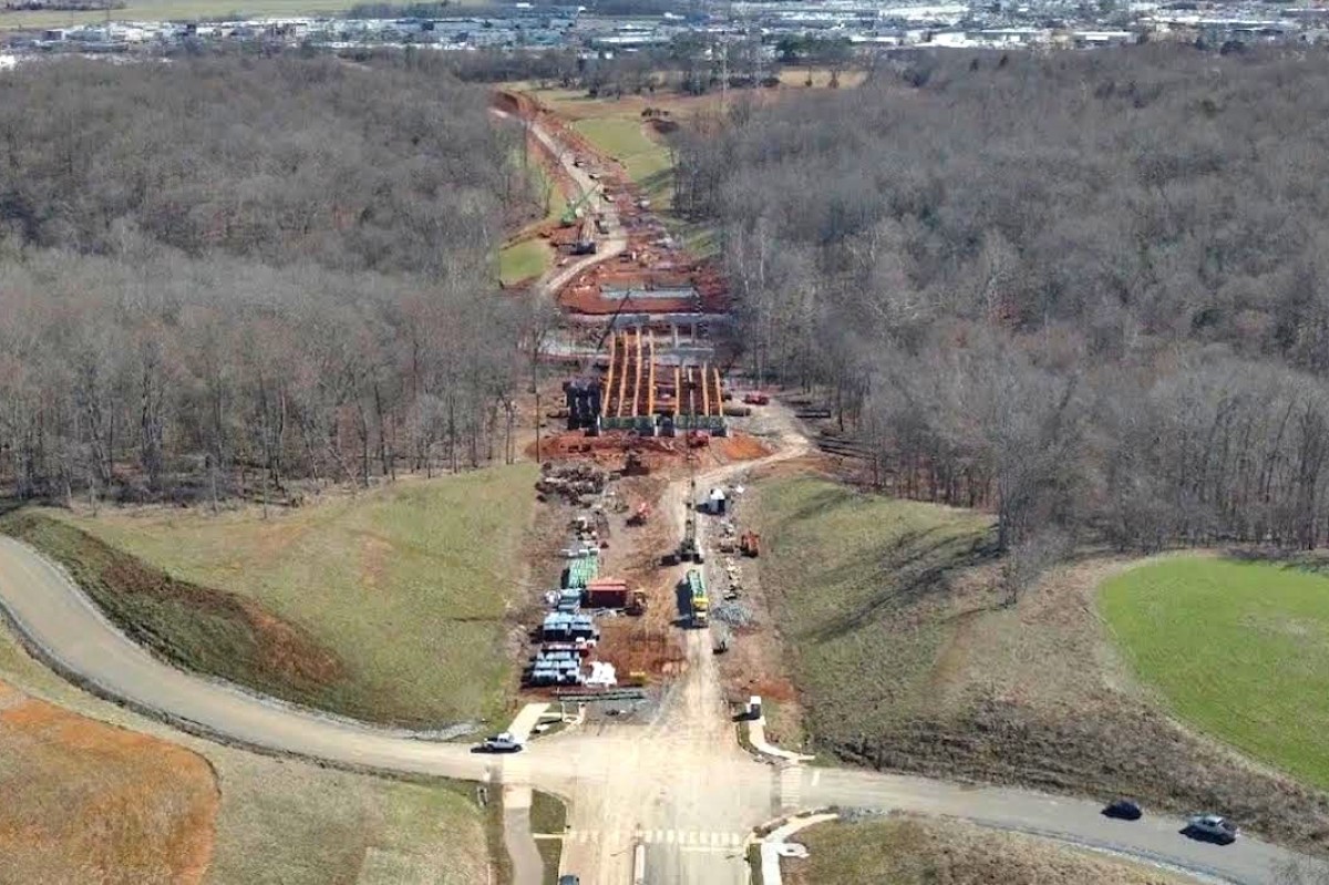 Aerial photo of progress on Spring Creek Parkway as of March 25, 2026. Shown is the bridge over Spring Creek, looking southeast toward Wilma Rudolph Boulevard, with Walmart at left and Kohls at right. (City of Clarksville, contributed)