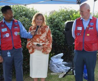 Joel Cogdell, Lowes Division President of the South, Marcia Clark, wife of late Nathan Clarks and Shannon Tucker, Lowes Regional Vice President, at Lowes on Madison St. in Clarksville road-dedication for the late Nathan Clark on Mar. 27, 2026. (Lee Erwin)