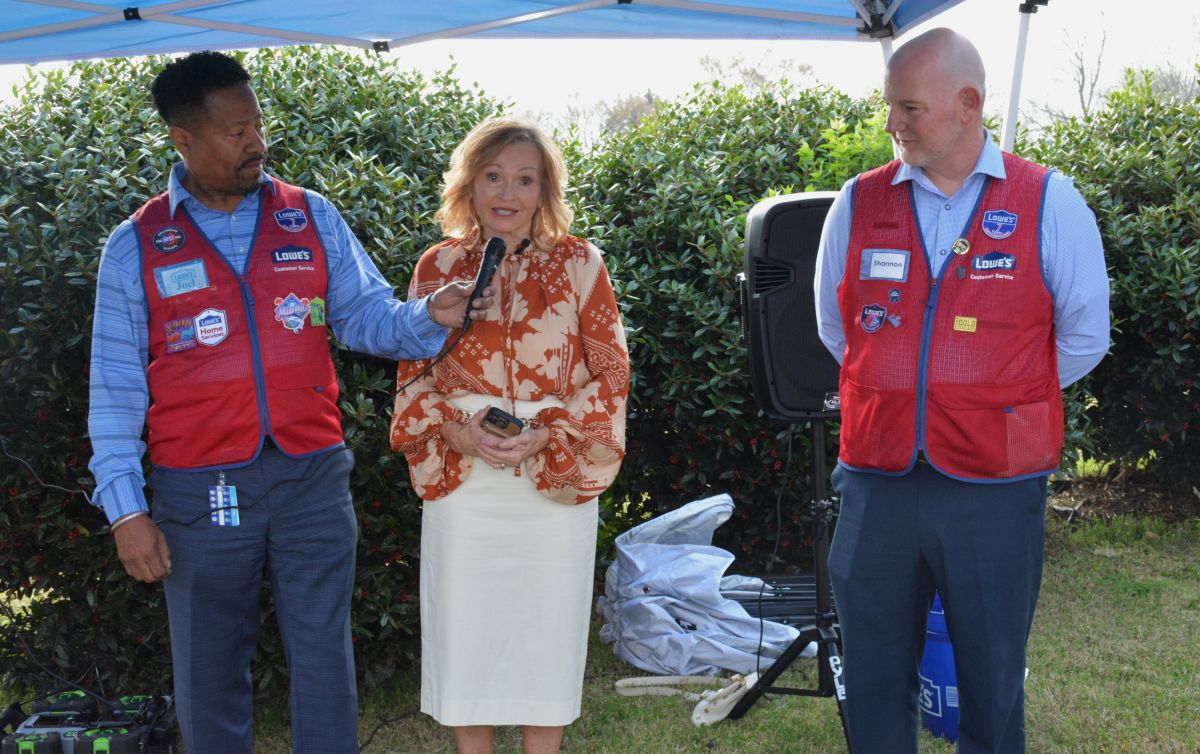 Joel Cogdell, Lowes Division President of the South, Marcia Clark, wife of late Nathan Clarks and Shannon Tucker, Lowes Regional Vice President, at Lowes on Madison St. in Clarksville road-dedication for the late Nathan Clark on Mar. 27, 2026. (Lee Erwin)