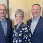 Charlie Koon, left, with Stephanie and Chris Travis.