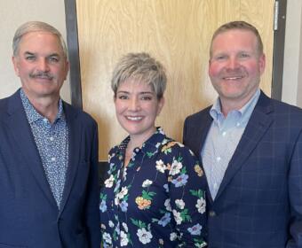 Charlie Koon, left, with Stephanie and Chris Travis.