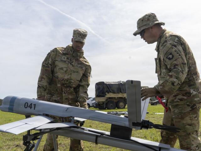 Staff Sgt. Brandon Livingston-Stephenson and Sgt. Abduel Taylor, assigned to 101st Airborne Division, set up the Aevex Atlas precision guided drone system at the Joint Readiness Training Center, Fort Polk, Louisiana, April 5, 2026. (U.S. Army photo by Spc. Mariam Diallo)