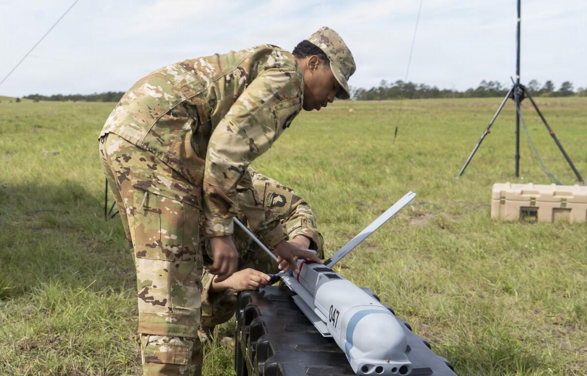 Staff Sgt. Brandon Livingston-Stephenson and Sgt. Abduel Taylor, assigned to 101st Airborne Division, set up the Aevex Atlas precision guided drone system at the Joint Readiness Training Center, Fort Polk, Louisiana, April 5, 2026. (U.S. Army photo by Spc. Mariam Diallo)