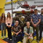 Davis Hunter, kneeling at left in black, with part of his team in 2023 at the Stennis Space Center. Wearing Hawaiian shirts on test days is a tradition for the team. (Contributed, Davis Hunter)
