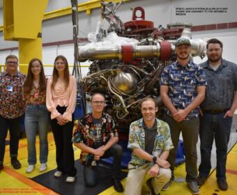 Davis Hunter, kneeling at left in black, with part of his team in 2023 at the Stennis Space Center. Wearing Hawaiian shirts on test days is a tradition for the team. (Contributed, Davis Hunter)
