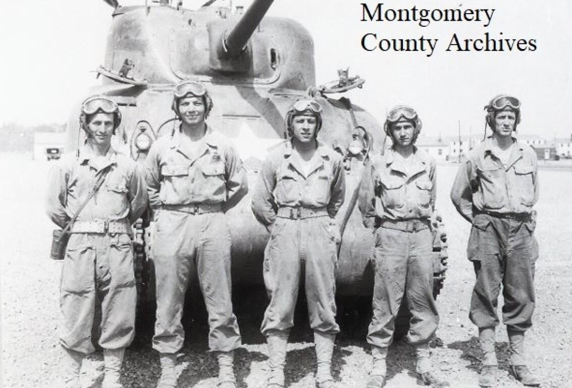 Troops of the 12th Armored Division, tank crew, standing in front of a tank at Camp Campbell, 1942. (Montgomery County Archives, contributed)