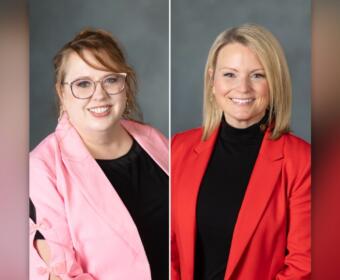Side-by-side portraits: left woman in pink blazer and glasses, right woman in red blazer with black top, gray backdrop.