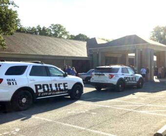 Clarksville Police outside 953 Clark Street on July 1, 2026, while barring entry. (Christian Brown)