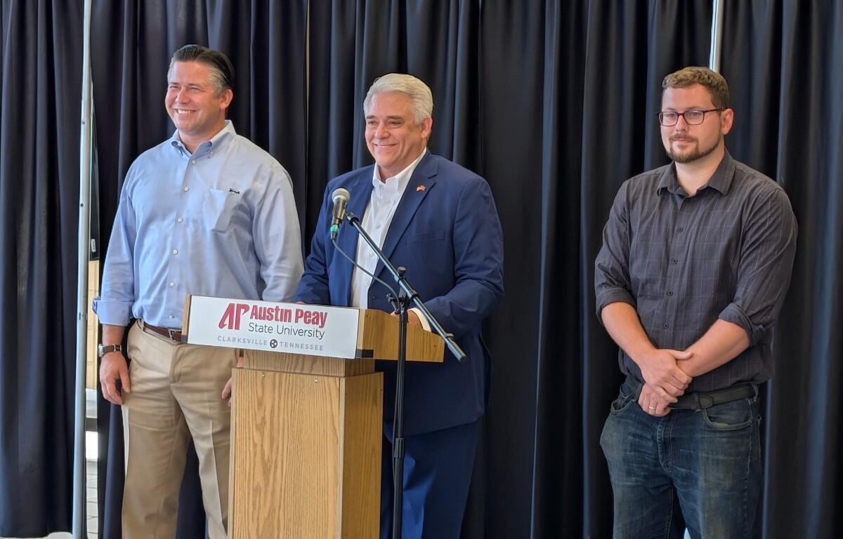Montgomery County mayor candidates Wes Golden, left, and Isaac Greenwood, right, with host Jay Albertia, center, at the Chamber of Commerce Meet the Candidates event on July 15, 2026. (Chris Smith)