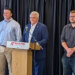 Montgomery County mayor candidates Wes Golden, left, and Isaac Greenwood, right, with host Jay Albertia, center, at the Chamber of Commerce Meet the Candidates event on July 15, 2026. (Chris Smith)
