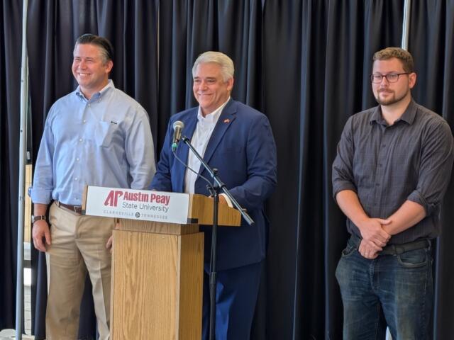Montgomery County mayor candidates Wes Golden, left, and Isaac Greenwood, right, with host Jay Albertia, center, at the Chamber of Commerce Meet the Candidates event on July 15, 2026. (Chris Smith)