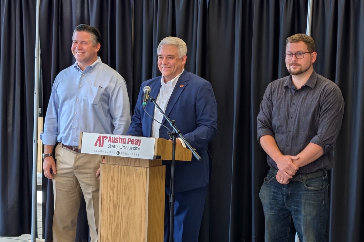 Montgomery County mayor candidates Wes Golden, left, and Isaac Greenwood, right, with host Jay Albertia, center, at the Chamber of Commerce Meet the Candidates event on July 15, 2026. (Chris Smith)