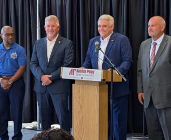 Montgomery County sheriff's candidates, from the left, Dexter Mines, Johnny Ransdell and, at right, Mike Oliver, with Jay Albertia, at microphone, at the Chamber of Commerce Meet the Candidates event on July 15, 2026. (Chris Smith)