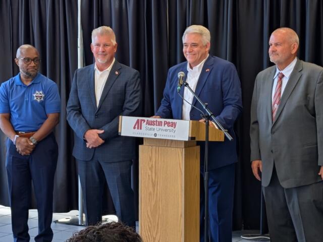 Montgomery County sheriff's candidates, from the left, Dexter Mines, Johnny Ransdell and, at right, Mike Oliver, with Jay Albertia, at microphone, at the Chamber of Commerce Meet the Candidates event on July 15, 2026. (Chris Smith)
