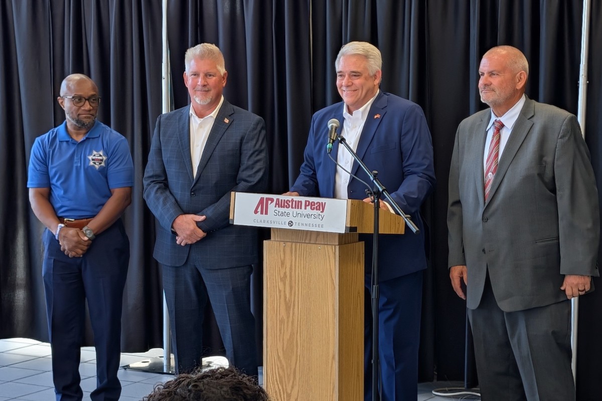 Montgomery County sheriff's candidates, from the left, Dexter Mines, Johnny Ransdell and, at right, Mike Oliver, with Jay Albertia, at microphone, at the Chamber of Commerce Meet the Candidates event on July 15, 2026. (Chris Smith)