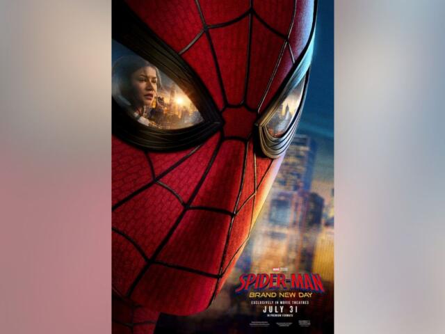 Close-up of Spider-Man’s red mask with a city skyline reflected in the eye lenses; film poster text at the bottom.