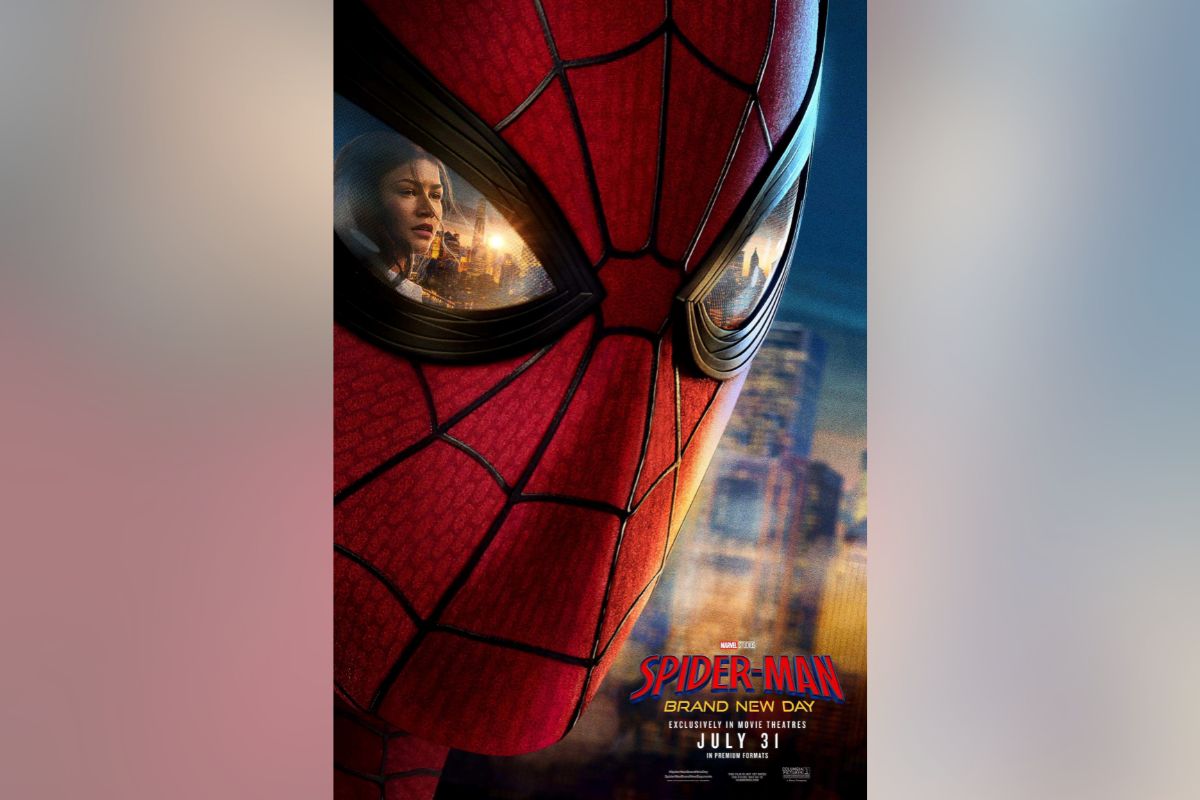 Close-up of Spider-Man’s red mask with a city skyline reflected in the eye lenses; film poster text at the bottom.