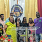 Gloria J. Sweet-Love with Darius Chappell's mother and other family on July 4, 2026. (Nia Holland)