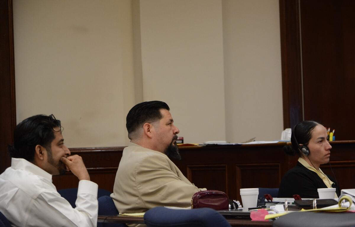Reynaldo Salinas-Cruz, left, and Sofia Rodas, far right, at the Montgomery County Courts Center on Aug. 25, 2026. (Jazmin Logan)