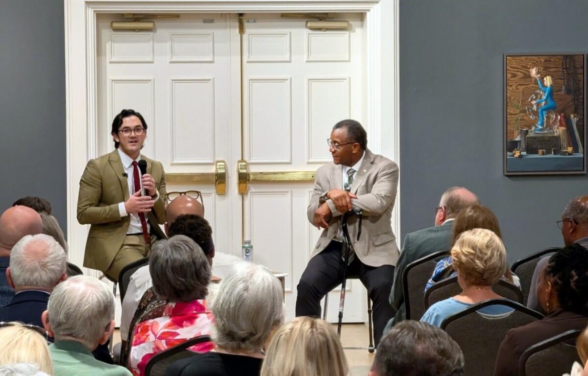 Cameron O’Hanlon, left, and Joe Shakeenab speak with community stakeholders about plans for the Performing Arts Center on Aug. 12, 2026. (Chris Smith)