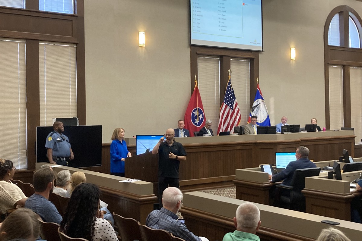 Artie Terrell Grassman addressing the Montgomery County Commission with interpreter Michael Brewer on Aug. 10, 2026. (Christian Brown)