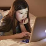 Student using a laptop computer at home. (Metro Creative Services)