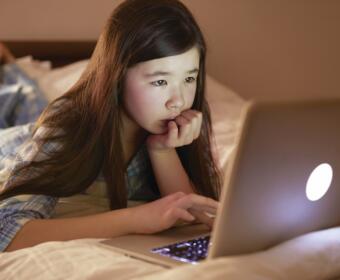 Student using a laptop computer at home. (Metro Creative Services)