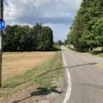Rosson Road looking north from Trough Springs Road. The site for the planned ICE call center would be in the distance on the left. (Christian Brown)