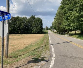 Rosson Road looking north from Trough Springs Road. The site for the planned ICE call center would be in the distance on the left. (Christian Brown)