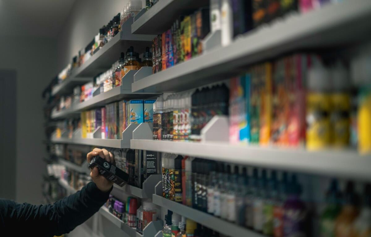 Vape liquids in a smoke shop. (Unsplash)