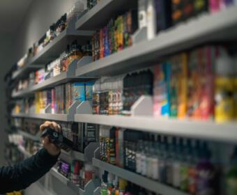 Vape liquids in a smoke shop. (Unsplash)