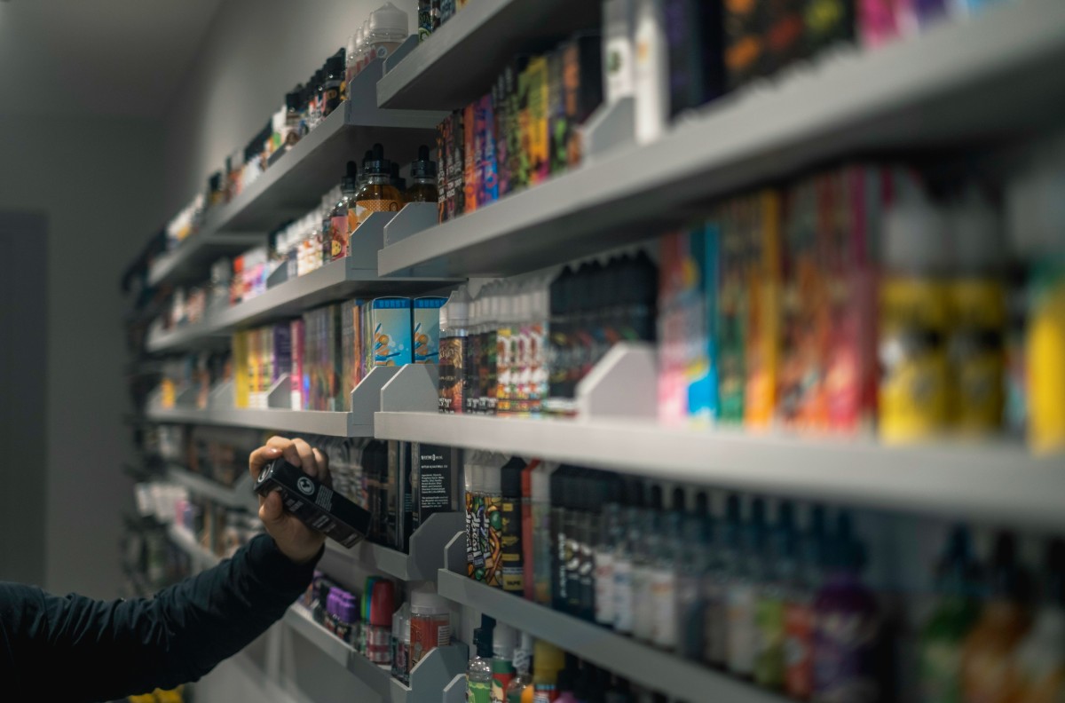 Vape liquids in a smoke shop. (Unsplash)