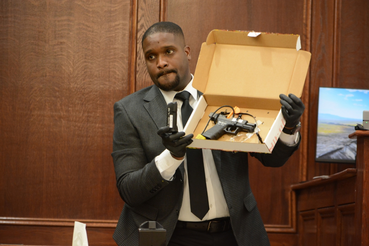 Agent Xavier Greaves holding up the murder weapon for jurors at the Montgomery County Courts Center on Sept. 28, 2026. (Jazmin Logan)