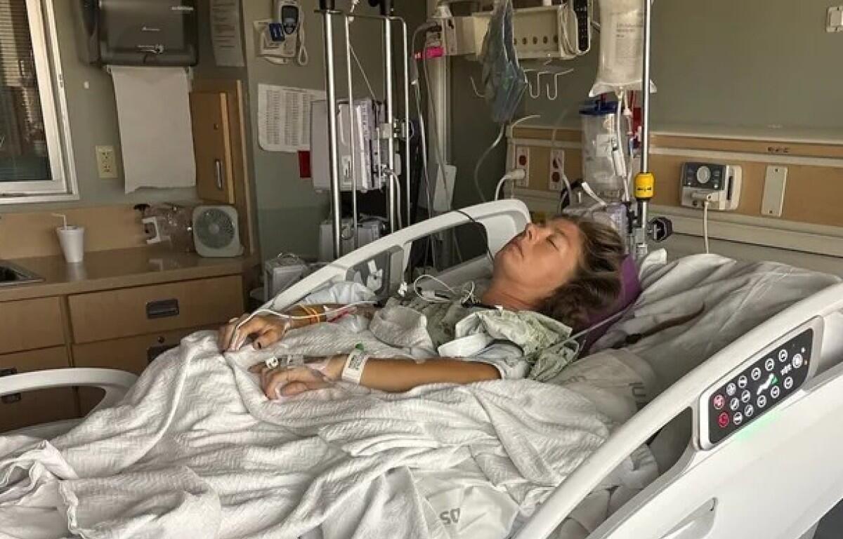 Jamie Ulshoffer in the hospital after a man fell from a tree and landed on her at a festival in Louisville, Kentucky. (Contributed)