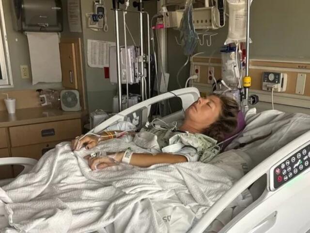 Jamie Ulshoffer in the hospital after a man fell from a tree and landed on her at a festival in Louisville, Kentucky. (Contributed)