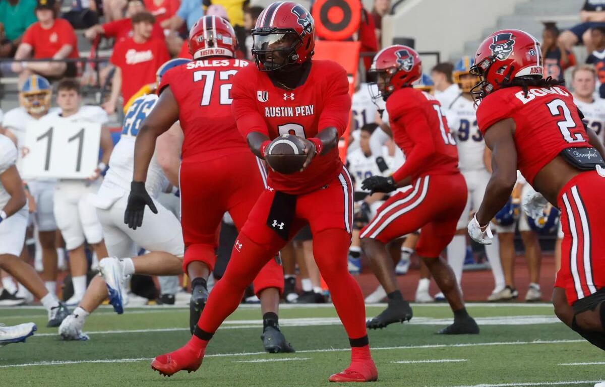 Chris Parson hands the ball off against Morehead State on September 13, 2025. (Robert Smith, APSU Athletics).