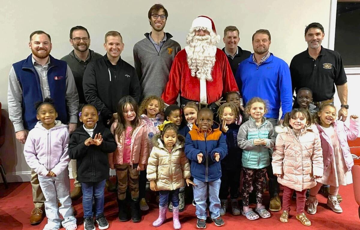 Santa and Kiwanians with children (Kiwanis Club of Clarksville, contributed)