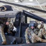 A 101st Combat Aviation Brigade pilot conducts egress testing from an AH-64 Apache helicopter while equipped with the Advanced Inflight Relief Universal System (AIRUS) at Fort Campbell, Oct. 5, 2026. (U.S. Army photo by Capt. Andrew Lightsey IV)